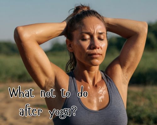 Post-yoga sweat beads on focused woman’s skin.
